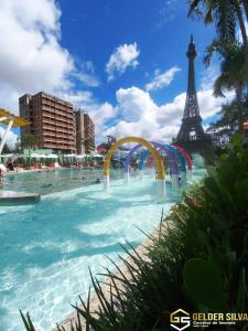 a water park with the eiffel tower in the background at Flats CTC Araras in Caldas Novas