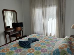 Postel nebo postele na pokoji v ubytování Hotel Al-Andalus