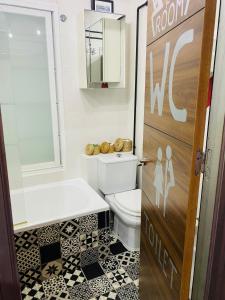a bathroom with a toilet and a sink at Duplex La Cala in Cala del Moral