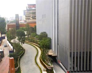 arial view of a street in a city with a building at LA ISRA at KL in Kuala Lumpur
