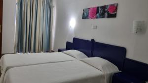 Postel nebo postele na pokoji v ubytování Club praia da Rocha III