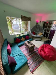 a living room with a blue couch and a rug at Delta Sharm Apartments with free Internet Wi-Fi in Sharm El Sheikh +90 photos