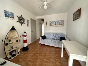 a room with a bed and a lighthouse in it at Casita de Bolonia in Bolonia