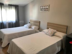 Cama o camas de una habitación en Apartamento centro con vistas