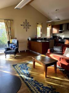 a living room with a couch and a coffee table at Ballyhoura Forest Home in Ballyorgan