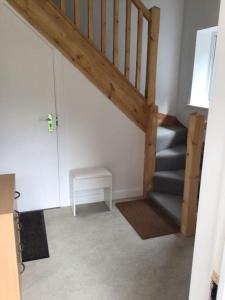 a staircase in a room with a stair case at Prestatyn Loft in Prestatyn