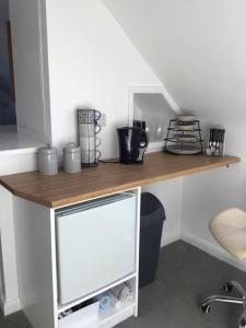 a wooden counter top in a room with a desk at Prestatyn Loft in Prestatyn