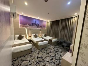 Postel nebo postele na pokoji v ubytování فندق اسكنت الحفاير - Askant Al Hafayer Hotel