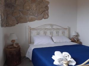 A bed or beds in a room at Casale Tano