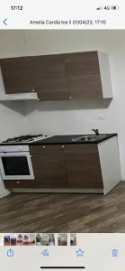 a kitchen with a stove and a counter top at Casa Marta in Cava deʼ Tirreni