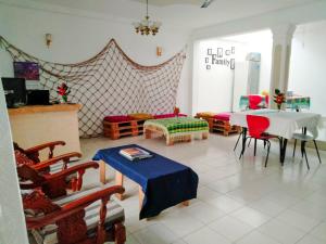 a living room with a table and chairs at Backpacker Galle Hostel in Galle