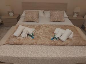 En eller flere senge i et værelse på Casa Vacanza Crystal
