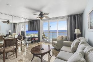 a living room with a view of the ocean at Beach Front 18th Flr, Best Ocean View, New Upgrades in Destin