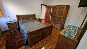 Un pat sau paturi într-o cameră la Casa das Tílias