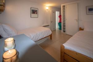 Posteľ alebo postele v izbe v ubytovaní Maison Fesch, vue panoramique, 120m2, Piscine, 3ch