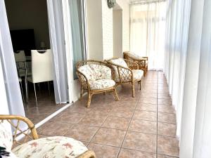 a hallway with chairs and a table in a room at Gabriel in Calpe
