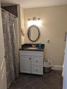 a bathroom with a sink and a mirror at Waterfront ground floor condo Sheepscot Harbour Vacation Club 1 Bedroom Condo #205 in Edgecomb