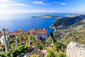 an aerial view of a castle on a hill next to the ocean at Studio tout confort avec parking et terrasse à Eze village in Éze