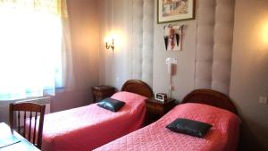Postel nebo postele na pokoji v ubytování Hotel Le Clos du Montvinage