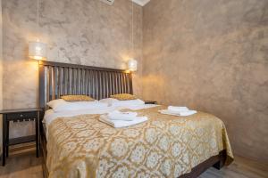Katil atau katil-katil dalam bilik di Premium Wenceslas Square Apartments
