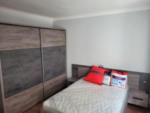 a bedroom with a bed with two bags on it at KeLi in Poitiers