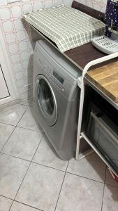 a washing machine with a counter on top of it at Artemide Home in Taranto