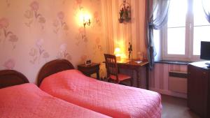Postel nebo postele na pokoji v ubytování Hotel Le Clos du Montvinage