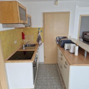a small kitchen with a sink and a counter at Ferienwohnung Varli in Tuttlingen