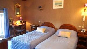 Postel nebo postele na pokoji v ubytování Hotel Le Clos du Montvinage