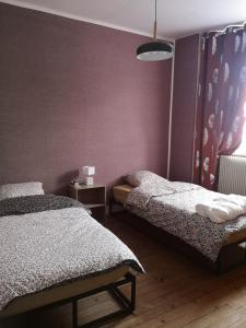 Łóżko lub łóżka w pokoju w obiekcie Le repos bien mérité