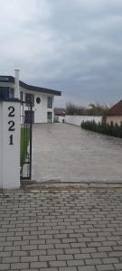a parking lot in front of a white building at Accent Garden in Deva +5 photos