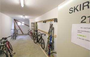 a room with several bikes hanging on a wall at Nice Apartment In Oberreute With House A Mountain View in Oberreute