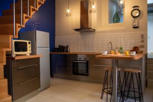 Kuchyňa alebo kuchynka v ubytovaní Le Triplex - 4 pers - Wifi - Centre ville