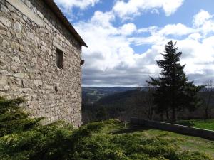 a view from the side of a stone building at Gite Bellevue 