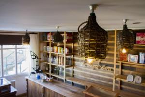 a room with a book shelf and some lights at Hotel Boutique La Yegua Loca in Punta Arenas +79 photos