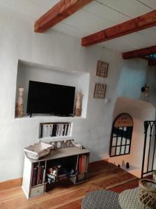 a living room with a flat screen tv on a wall at Navajos in Buis-les-Baronnies