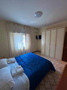 Кровать или кровати в номере Villa Gianna