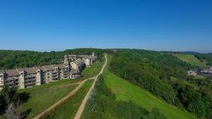 an aerial view of a building on a hill at Seven Springs Stoneridge 3 Bedroom Standard Condo, Mountain Views! condo in Champion