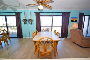a dining room with a table and chairs at Bay Princess 211 in Ocean City