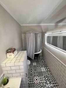 a small bathroom with a toilet and a sink at La Casita in Ardales +17 photos