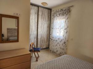 Postel nebo postele na pokoji v ubytování APARTAMENTO ÁTICO EN GÜÍMAR