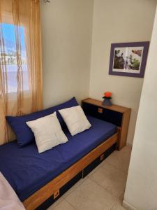 Postel nebo postele na pokoji v ubytování APARTAMENTO ÁTICO EN GÜÍMAR