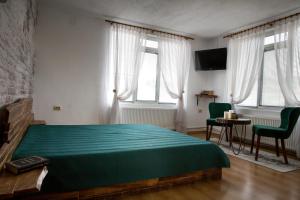 Postel nebo postele na pokoji v ubytování къща Слави