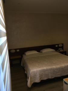 Postel nebo postele na pokoji v ubytování Hotel San Giorgio