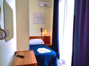 Rúm í herbergi á Hotel Staccoli