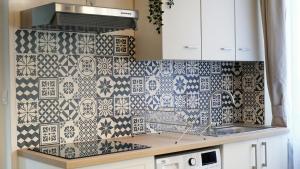 Kuchyňa alebo kuchynka v ubytovaní Appartement Cosy - En face de la gare, au centre ville
