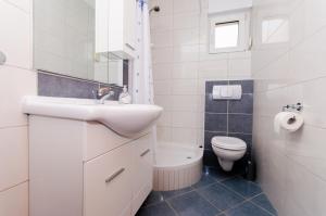 Koupelna v ubytování Ciovo view apartments + 33 fotografií