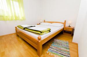 Postel nebo postele na pokoji v ubytování Ciovo view apartments