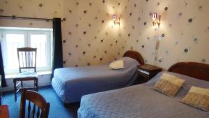 Postel nebo postele na pokoji v ubytování Hotel Le Clos du Montvinage