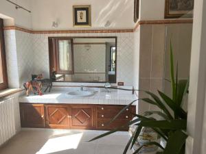 a bathroom with a sink and a mirror at Domus Orestea Luxury Suites in Palermo